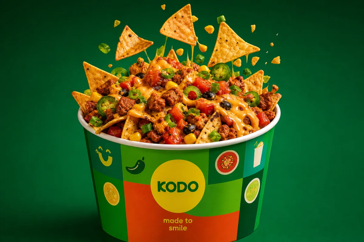Loaded Kodo nachos with cheese, salsa, jalapeño and vegetables